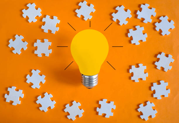 istock Business concept,idea,innovation,recruitment,human resources,start up.Light bulb and jigsaw puzzle pieces 1557684089