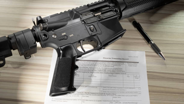 istock Purchase paperwork to by an AR-15 1557713398