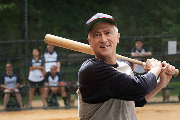 Senior man swinging bat New York City batting sports activity stock pictures, royalty-free photos & images