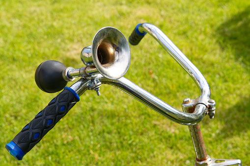 Vintage horn on handlebar of an old bicycle