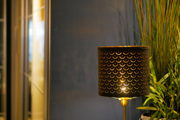 a lamp in home against white wall .