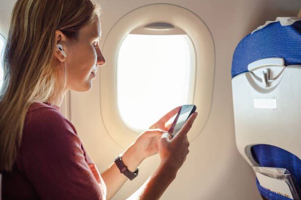 istock Young woman traveling with airplane 1557794897