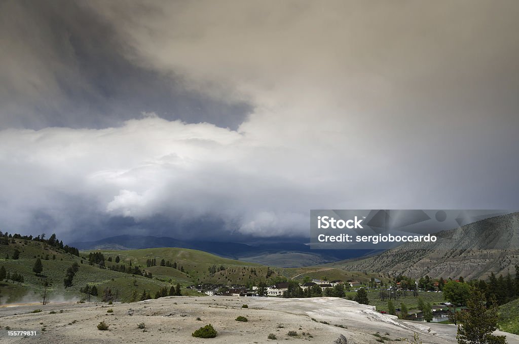 black clouds at Mammoth Hot Springs landscape with dark clouds in Mammoth Hot Springs in Yellowstone National Park in Wyoming in the United States of America Wyoming Stock Photo