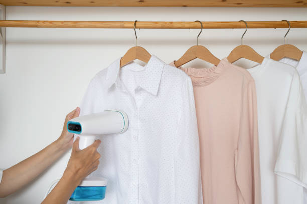 istock An unrecognizable woman steams a shirt 1557860911