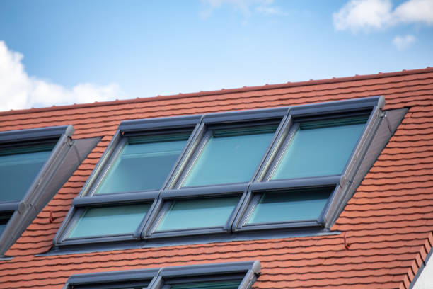 istock Newly tiled roof with large skylight windows 1557907808