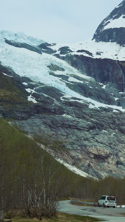 Camper Van on the Road With View of Idyllic Jostedalbreen Glacier in Norway