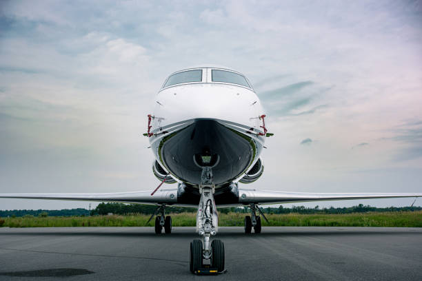 istock Private Jet Parked at an Airport 1557909872