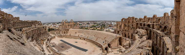 Amphitheatre of El Jem in Tunisia. Amphitheatre is in the modern-day city of El Djem, Tunisia, formerly Thysdrus in the Roman province of Africa. It is listed by UNESCO since 1979 as a World Heritage Site
