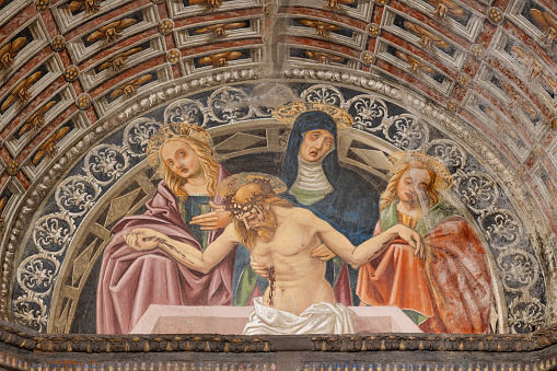 Biella - The Burial of Jesus fresco on the facade of the church Chiesa di San Sebastiano from 19. cent.