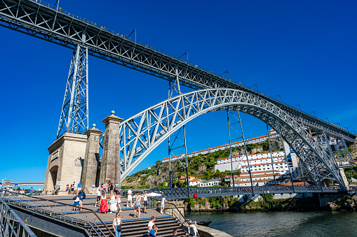 Porto. Portugal, 07/12/2023. Dom Luís I Bridge over Douro River full of tourists. High resolution 42Mp outdoors digital capture taken with SONY A7rII and Zeiss Batis 25mm F2.0 lens