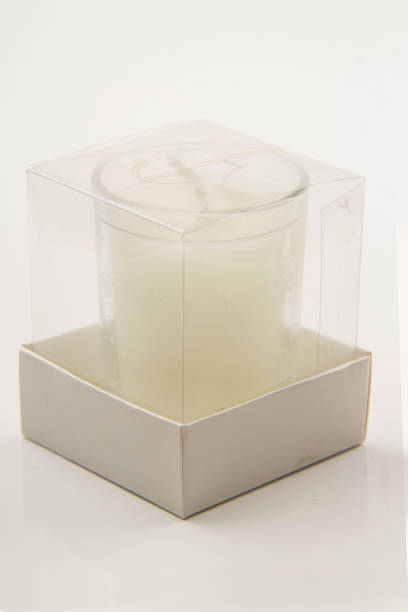 istock Glass Candle and metal lid on white background 1557926372