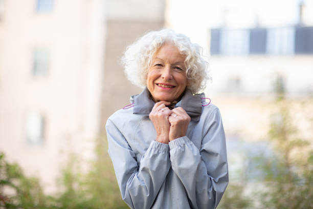 istock older woman cold with winter jacket 1557950108
