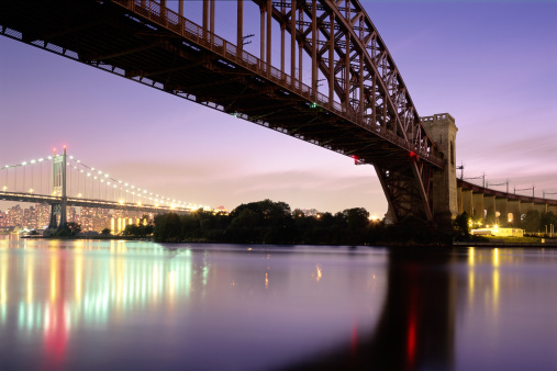 long exposure shot of the Hellgate Bridge and the tri borough bridge in Astoria, Queens.