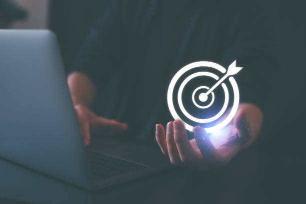 istock Hand holding target board for creative and set up business objective target and success and business goals in Concept of business strategy and future sustainable business finance action plan 1557965004