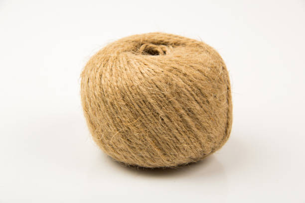 istock jute Twine isolated on white background. Vintage concept. 1557972575