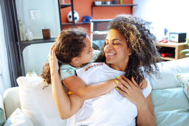 istock Mother and daughter embracing 1557992829