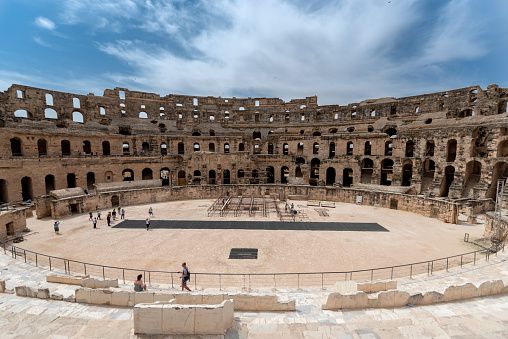 A panoramic view across the ruins of the immense Roman amphitheatre in El Jem, Tunisia.\nThe amphitheatre dominates the town and is a UNESCO World.