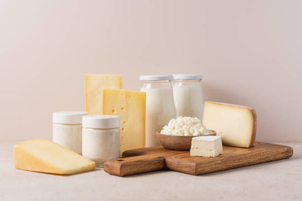 istock Farm dairy products on beige background 1558005910