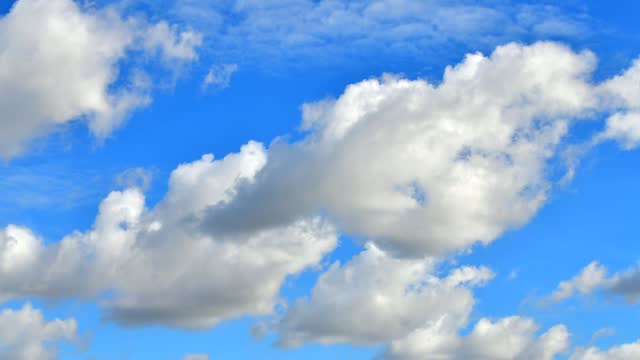 Beautiful timelapse of clouds rolling in blue sky.