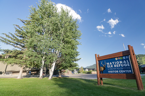 Place Sign for National Elk Refuge in Jackson (Jackson Hole) at Teton County, Wyoming, with illustrations and design elements visible.