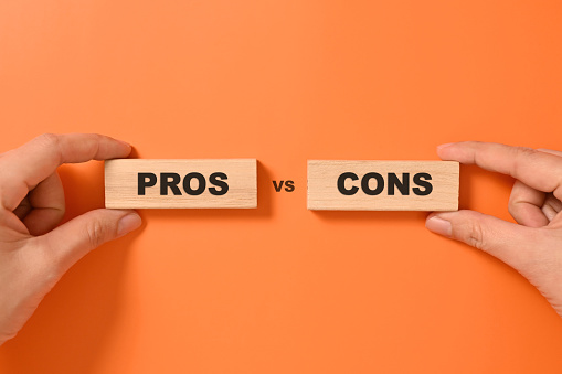 Pros and cons text on wooden blocks, Advantages and disadvantages for business management, Personal perspective, Concept of positive or negative decision making or choice of approval or rejection. High quality photo