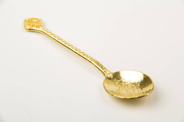 Stylish clean silver spoon on white background