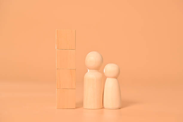 istock Wooden cubes mock up and dolls on background for text, Copy space, Wooden blocks with copy space for text or symbols, Background with copy space 1558095529