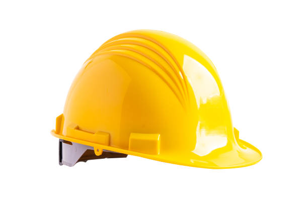 istock Yellow construction helmet isolated on white background with clipping path, engineer safety concept. 1558123012