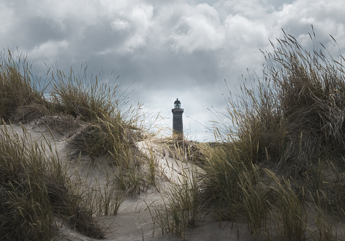 beautiful sand dunes and a lighthouse on the North Sea coast in Denmark
