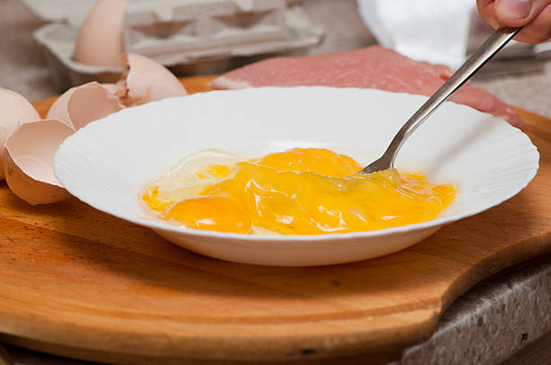 mixing eggs stock photo