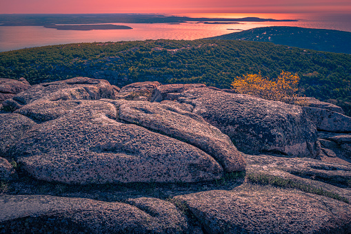 Sunset over the massive rock formations at the top of Cadillac Mountain in Bar Harbor, Maine