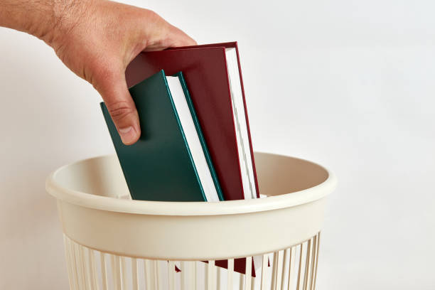 istock Books are thrown away for recycling and disposal 1558167824