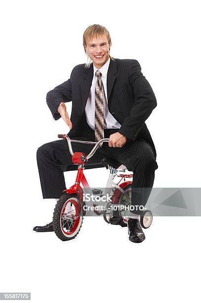 Foto de Empresário Em Criança De Bicicleta e mais fotos de stock de Bicicleta - Bicicleta, Criança, Homem de negócios