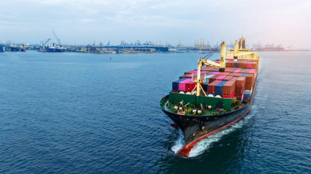 istock aerial front view Cargo Ship carrying container and running for export goods from cargo yard port to other ocean concept freight shipping ship 1558210757