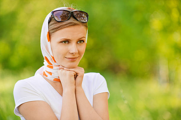 Woman in headscarf with sunshades stock photo