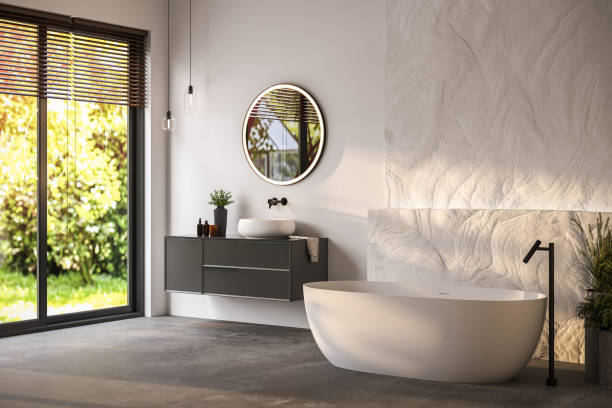 istock Modern bathroom interior with white bathtub and chic vanity, white walls, parquet floor. 1558214706