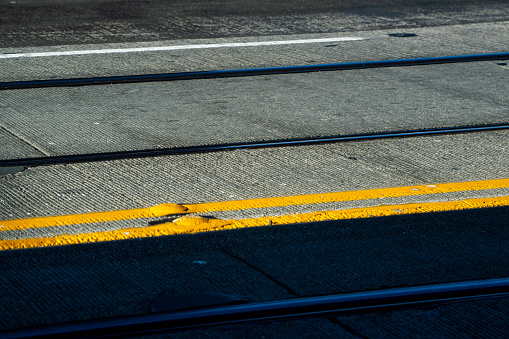 A close up view of rail tracks in a road in Seattle Washington State.  These tracks are used by the trolley that travels between Pioneer Square and Capitol Hill.