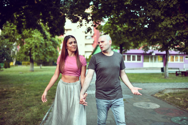 istock Female Walking With Husband Cancer Patient While Holding Hands 1558222312
