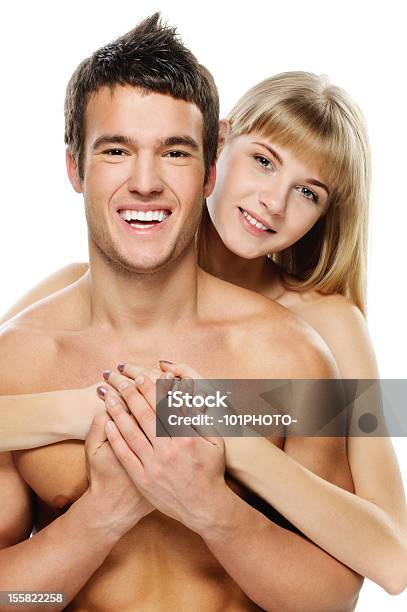 Junge Glückliche Paar Auf Weißem Hintergrund Stockfoto und mehr Bilder von Frauen - Frauen, Männer, Nackt