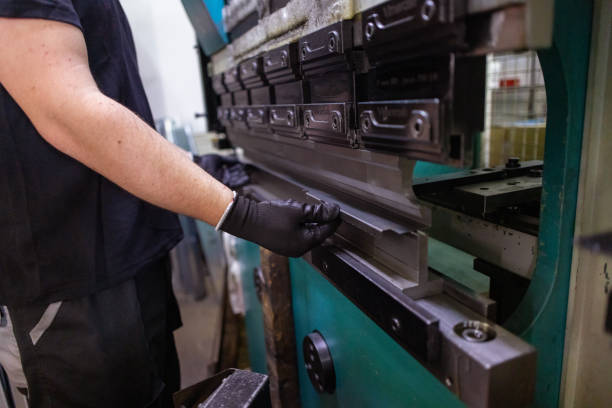 istock Worker Operating Laser Cutter in Factory 1558261112