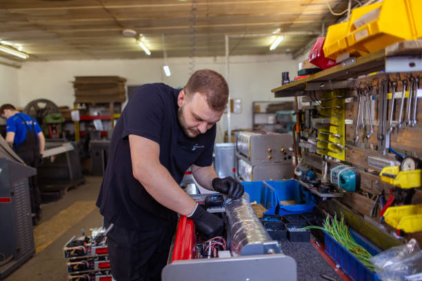 istock Factory Worker Handling Machinery 1558271747