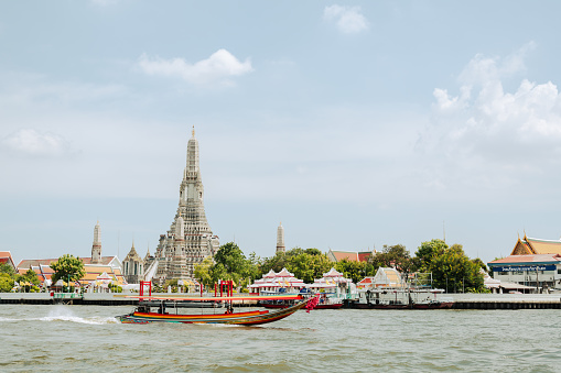 Bangkok, Thailand - June 29, 2023 : Wat Arun temple and Chao Phraya River