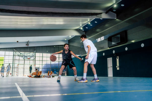 istock Two young boys playing basketball 1558307059