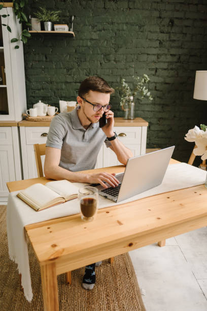 istock Business man trader analyst working, investor buys cryptocurrency. Broker analyzing indexes thinks. Trading online investment data on stock market. Marketing, learning. Homework on laptop. Freelance. 1558310813