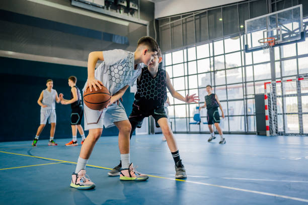 istock Teens basketball players having a training class 1558321769