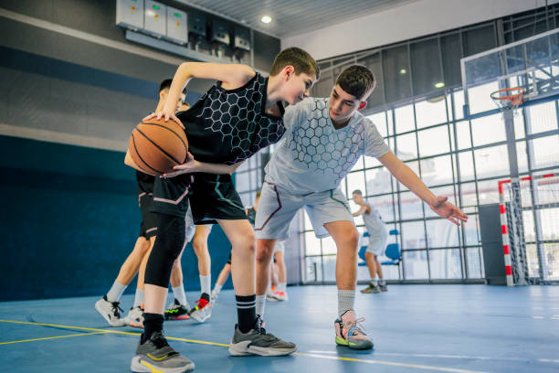 istock Young boys playing basketball 1558323390