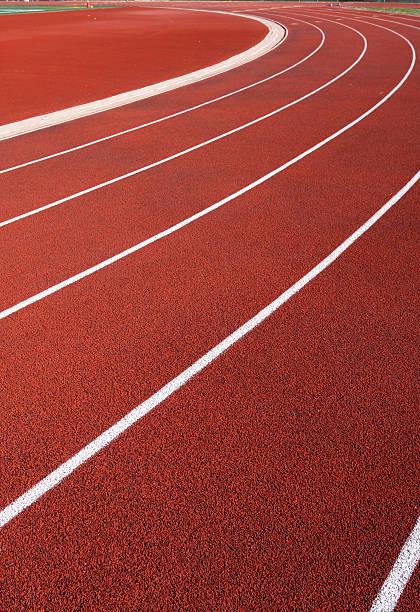 istock Curve of a Red Running Track 155832595