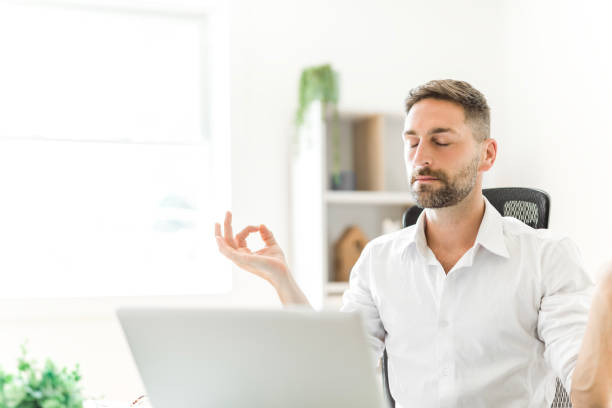 istock Mature business man using laptop computer in office. 1558326643