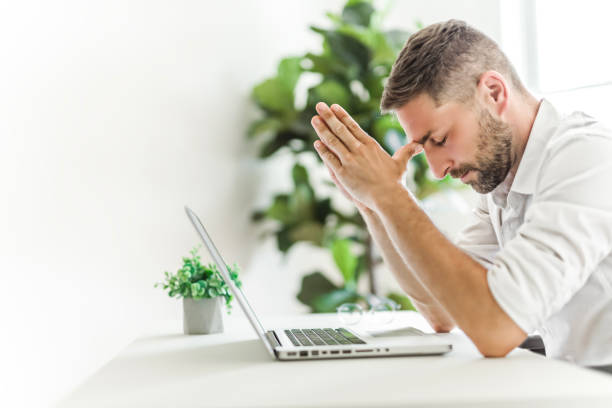 istock Mature business man using laptop computer in office look like frustrated 1558326644