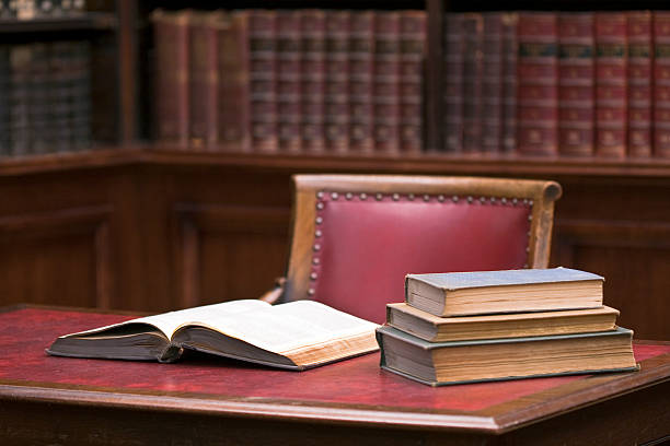 Red chair Desk library open book full shelves